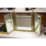 A brass framed triptych dressing mirror, height 56cm