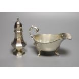 A George V silver sauceboat and an Edwardian silver pepperette, William Hutton & Sons, London, 1905,
