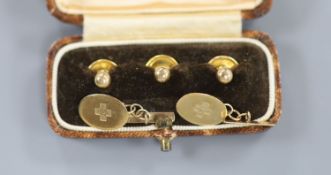 A pair of 9ct gold 'Millennium' oval cufflinks and three cased 9ct gold dress studs, gross 3.6