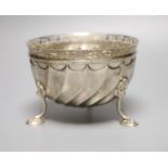 A late Victorian silver bowl, with pierced border of tripod feet, Wakely & Wheeler, London, 1895,