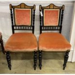 A pair of late Victorian marquetry inlaid ebonised side chairs