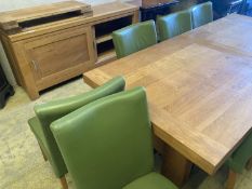A contemporary oak dining suite, comprising a refectory style extending dining table on heavy 'H'
