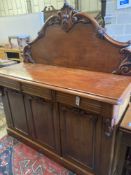 A Victorian carved mahogany sideboard fitted drawers and cupboard, length 150cm, depth 56cm,