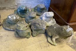 Eight reconstituted stone garden ornaments of frogs and toads, three as fountain heads, largest 18cm
