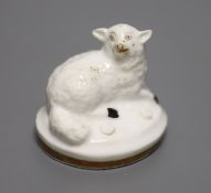 A Rockingham porcelain recumbent sheep, c.1830, height 3cmCONDITION: ex Dennis G. Rice collection.