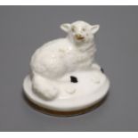 A Rockingham porcelain recumbent sheep, c.1830, height 3cmCONDITION: ex Dennis G. Rice collection.