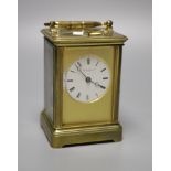 A brass carriage clock by Howell James & Co, height with handle down 13.5cm