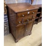 A Regency mahogany cupboard, fitted four drawers over a pair of fielded panelled doors (altered),