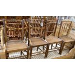 A set of four 19th century provincial ash and elm wood seat dining chairs