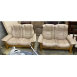 A pair of Norwegian Ekornes Stressless reclining two-seat settees with leather upholstery, length