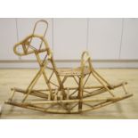 A bamboo and wicker rocking horse