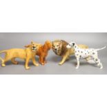 Two Beswick dogs, a lion and a lioness