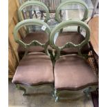 A set of four painted Victorian dining chairs and an oval centre table