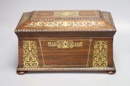 A Regency rosewood and cut brass inlaid sarcophagus shaped tea caddy, (mixing bowl restored), length