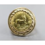 A 1980 one tenth gold Krugerrand, set in a 9ct gold ring mount, size M, gross 6.9 grams.