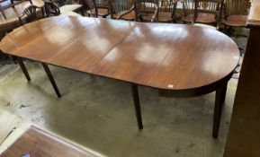 A George III mahogany 'D' end dining table, on square tapered legs, with three spare leaves, 274cm