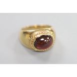 A 1970's Victorian style 9ct gold and cabochon garnet set dress ring, size I/J, gross 4.8 grams.