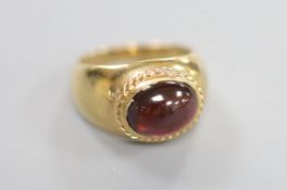 A 1970's Victorian style 9ct gold and cabochon garnet set dress ring, size I/J, gross 4.8 grams.