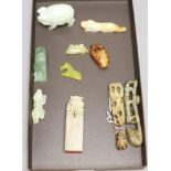 Six Chinese jade and hardstone animal carvings, two 'dragon' belt hooks, a ram's head and a