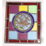 A rectangular stained glass and lead panel, 'bird' roundel to centre, 35 x 30cm