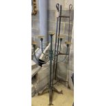 A wrought iron pot stand and large wrought iron five branch floor standing pricket candlestick,