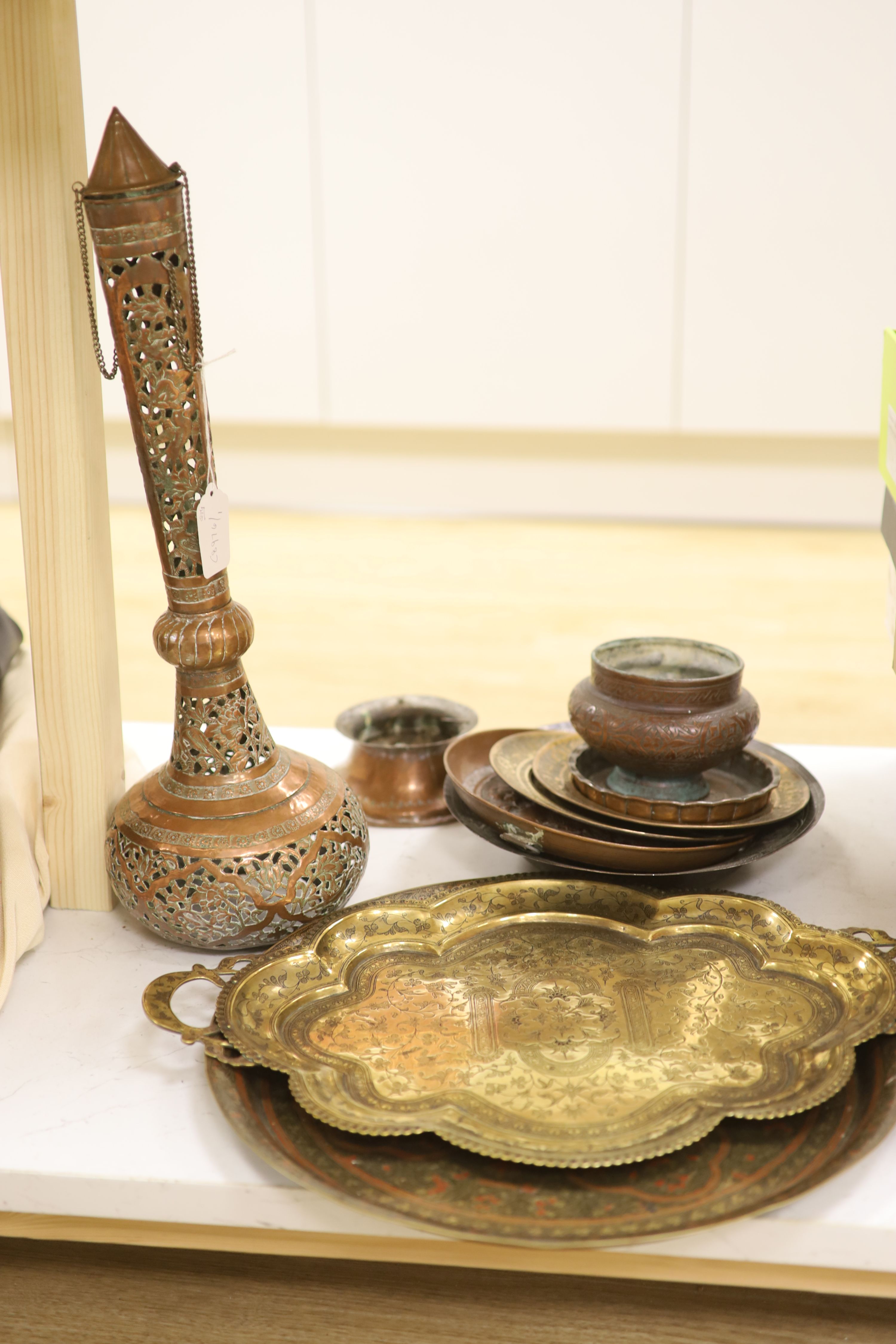 A group of Asian and copper trays, bowls etc