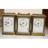 Three brass carriage timepieces
