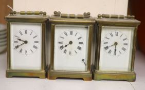 Three brass carriage timepieces