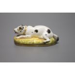 An English porcelain figure of resting dog, c.1830-50, width 13cmCONDITION: ex Dennis G. Rice