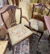 A set of six Hepplewhite style mahogany shield back dining chairs with tapestry drop in seats (two