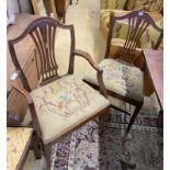 A set of six Hepplewhite style mahogany shield back dining chairs with tapestry drop in seats (two