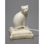 A Rockingham biscuit porcelain seated cat, c.1830, height 5cmCONDITION: ex Dennis G. Rice