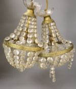 A pair of 20th century brass cut glass ceiling lights