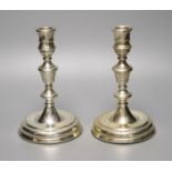 A pair of George II style silver presentation candlesticks, weighted, London 1986, 18.3cm, David