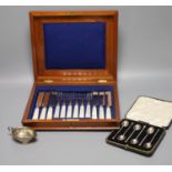 A cased set of plated mother of pearl handled cutlery, a cased set of six silver coffee spoons and a