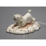 A Staffordshire porcelain poodle with upraised hind legs, c.1840, width 9cmCONDITION: ex Dennis G.