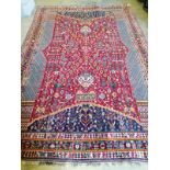 A North West Persian red ground carpet, 300 x 200cm