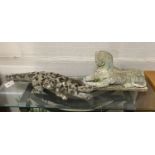 Two reconstituted stone garden ornaments, one of a crocodile, 76cm long the other a sphinx, 48cm