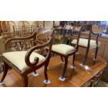 A set of eight Regency mahogany brass inlaid dining chairs, on sabre legs and a similar elbow chair