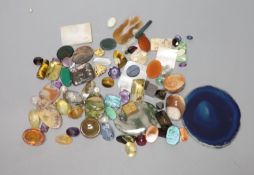A group of loose precious and semi precious stones, including citrine, moss agate, tiger's eye
