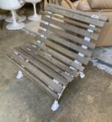 A small slatted cast iron garden bench, length 76cm, depth 80cm, height 75cm