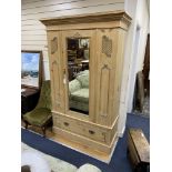 An Edwardian pine mirrored door wardrobe, width 124cm, depth 52cm, height 199cm