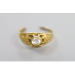 A yellow metal(tests as 18ct) and white stone set ring, cut, gross 2.2 grams.