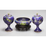 A pair of early 20th century Chinese cloisonne enamel jars and covers and a similar bowl and wood