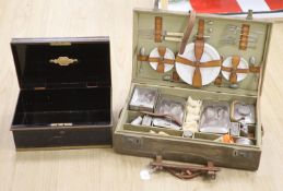 A 1930's picnic set, in a canvas covered case (incomplete)