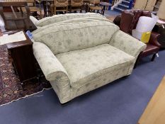 A pair of modern green floral upholstered two seater settees, length 164cm, depth 93cm, height 82cm