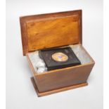 A mahogany box of world coins