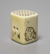 An ivory netsuke in the form of a pillow, Meiji period, height 3cm