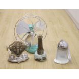 Early 20th century metal toaster and electric fan and lighthouse lamp and juicer