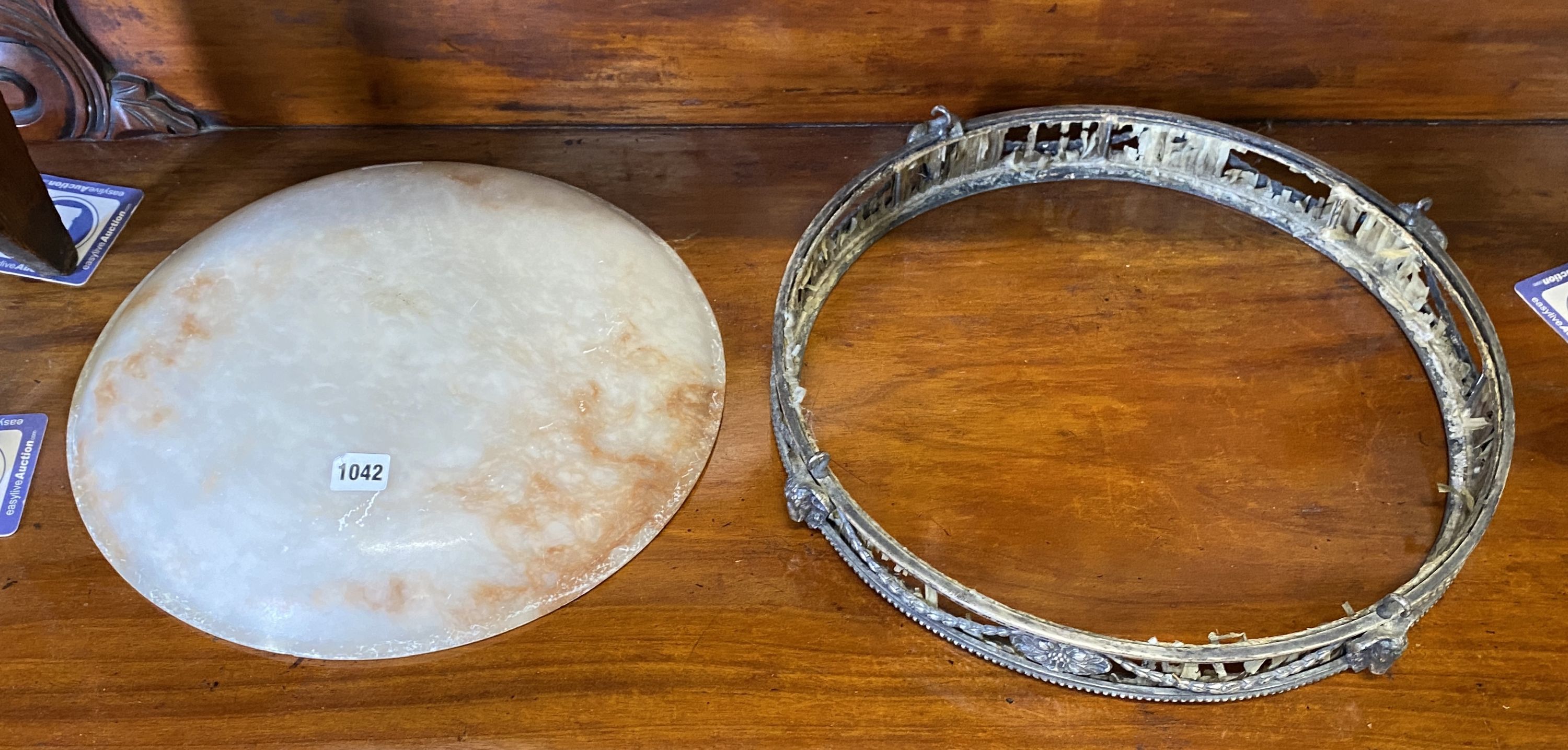 A pendant dish with metal rim and ceramic shade